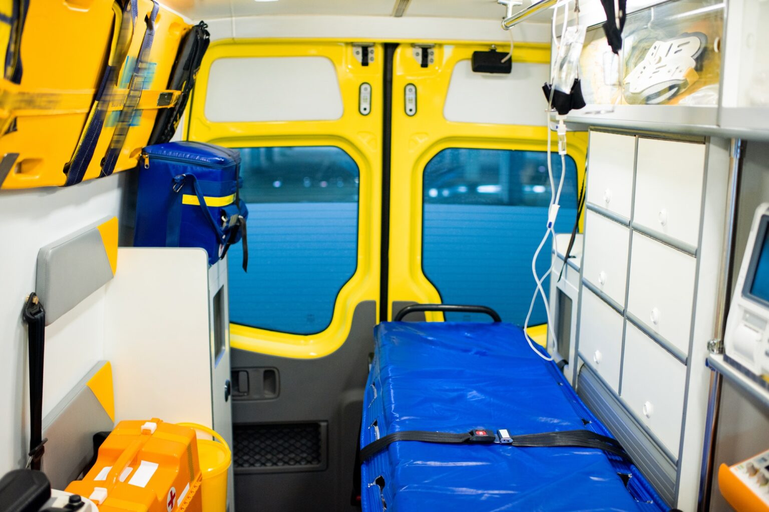 Interior of contemporary ambulance car with stretcher and medical equipment